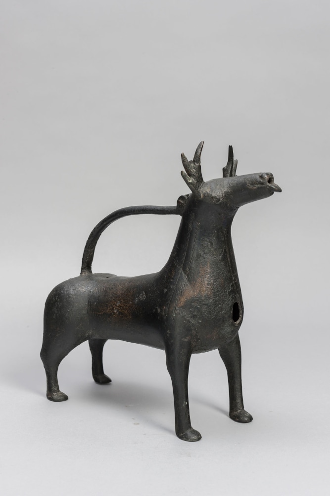 An Aquamanile in the form of a Stag, 12th century
Scandinavia or Lower Saxony
Bronze with a black patina, in excellent condition, missing only its sprue-hole cover; possibly some lost elements on the antlers and tail
9 5/8 x 3 5/8 x 9 1/8 inches
(24.5 x 9.3 x 23.2 cm)