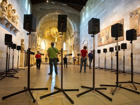 Circle of speakers set up inside The Cloisters