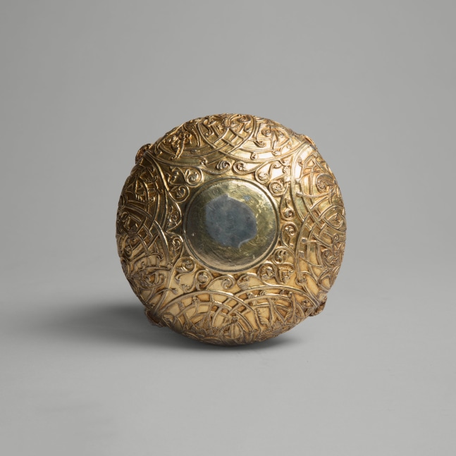 A cup with lions&amp;rsquo; heads emitting flowering rinceaux, c. 1180
England
Cast, chased, gilded and tooled silver with inlaid blue glass eyes
2 1/2 x 5 7/8 x 5 7/8 inches
(6.3 x 15 x 15 cm)